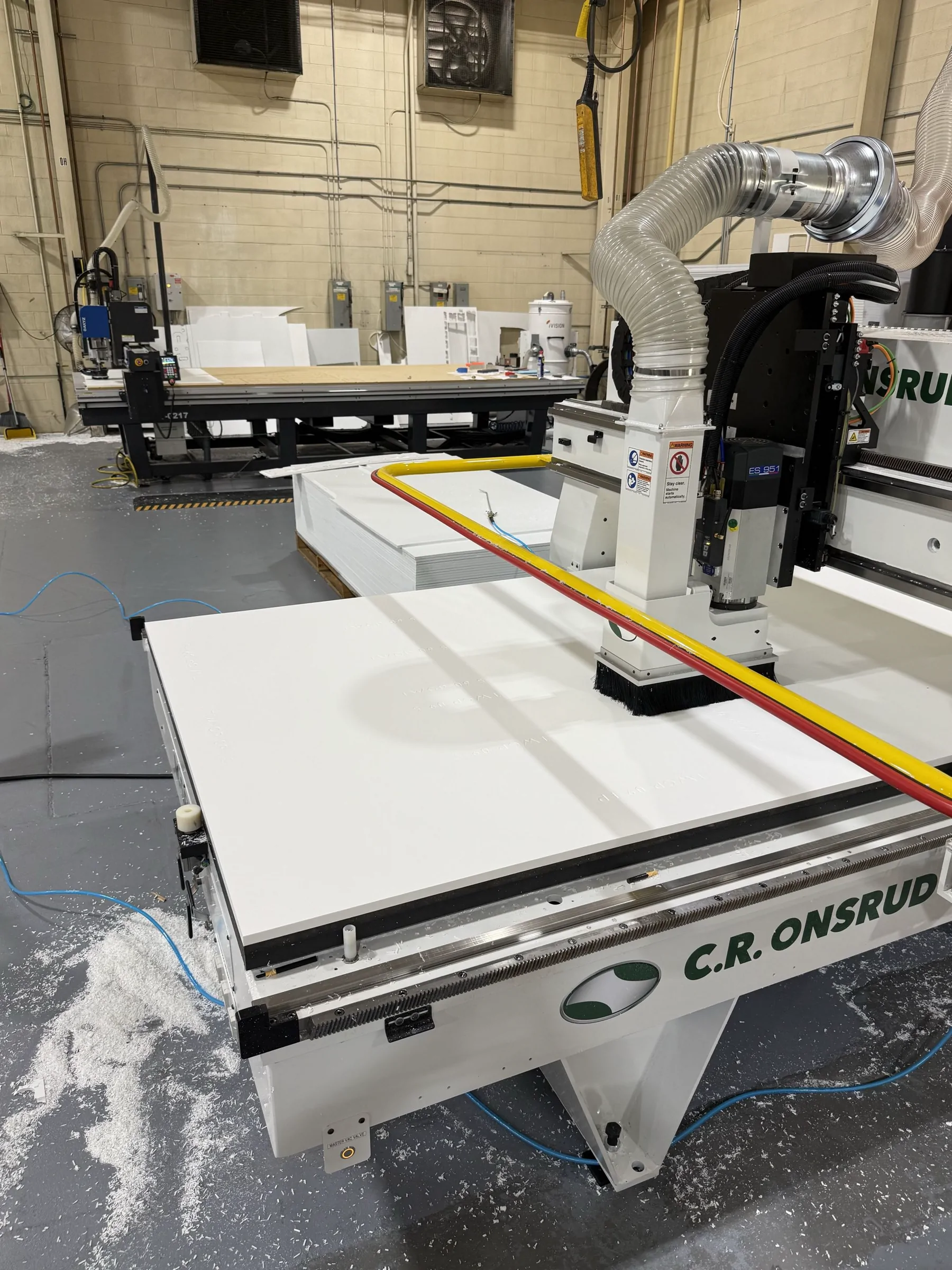 CNC routing equipment cutting a marine component